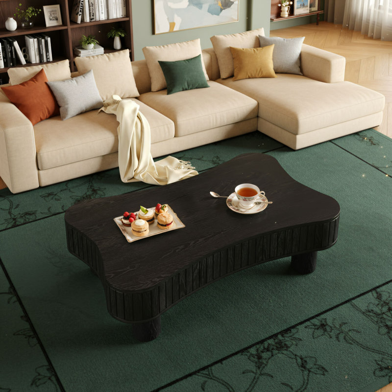 Table basse de salon silencieuse: l'apparence noire est polyvalente, le rangement à panneau rainuré dissimule le design incurvé des coins sécuritaires