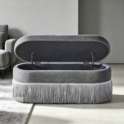 Pouf de rangement ovale capitonné avec franges et couvercle relevable, repose-pieds multifonctionnel et rangement dissimulé pour salon ou chambre - Tissu gris avec structure en métal
