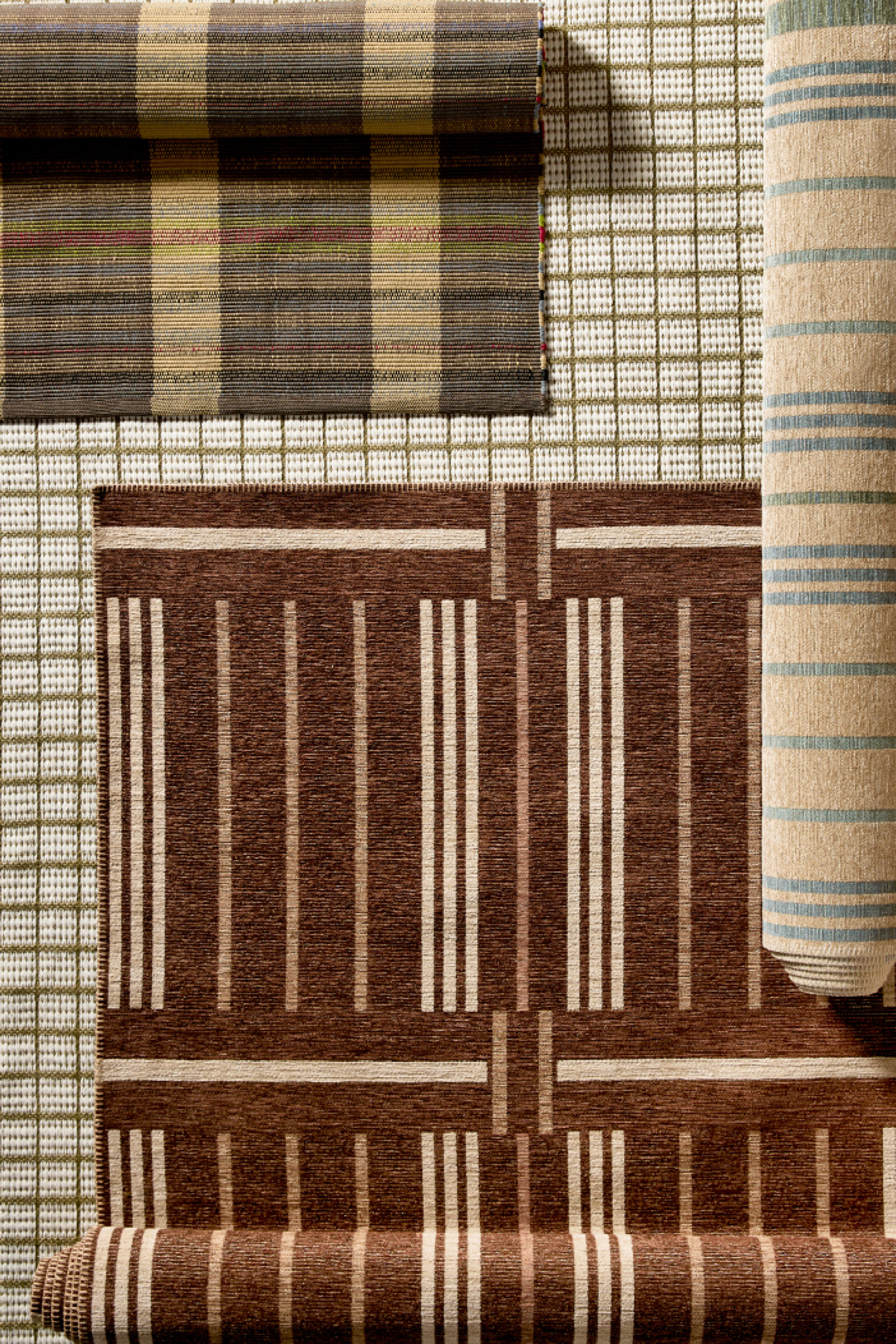 Overhead shot of four different area rug patterns.