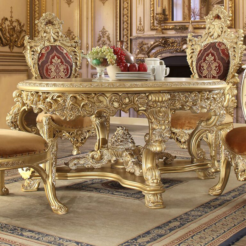 Table de salle à manger or métallique sculptée à la main avec base ornée
