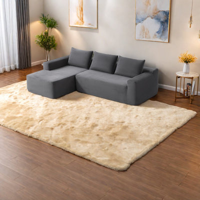 Canapé modulaire spacieux, revêtement en velours côtelé et méridienne moderne en forme de L
