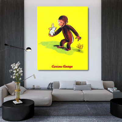 Curieux George tient un lapin