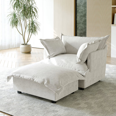 Upholstered Armchair with Footstool
