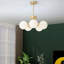 Lustre 5 têtes à finition dorée