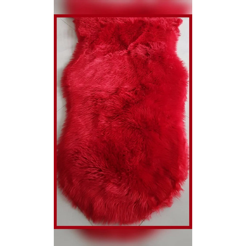 Oval Solid Colour Sheepskin 60cm X 110cm Area Rug, Red