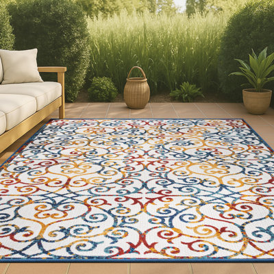 Tapis intérieur / extérieur crème / bleu / rouge Rhianne