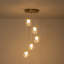 Luminaire suspendu 5 lumières moderne en métal doré avec abat-jour sphériques transparents pour hall d'entrée et salon