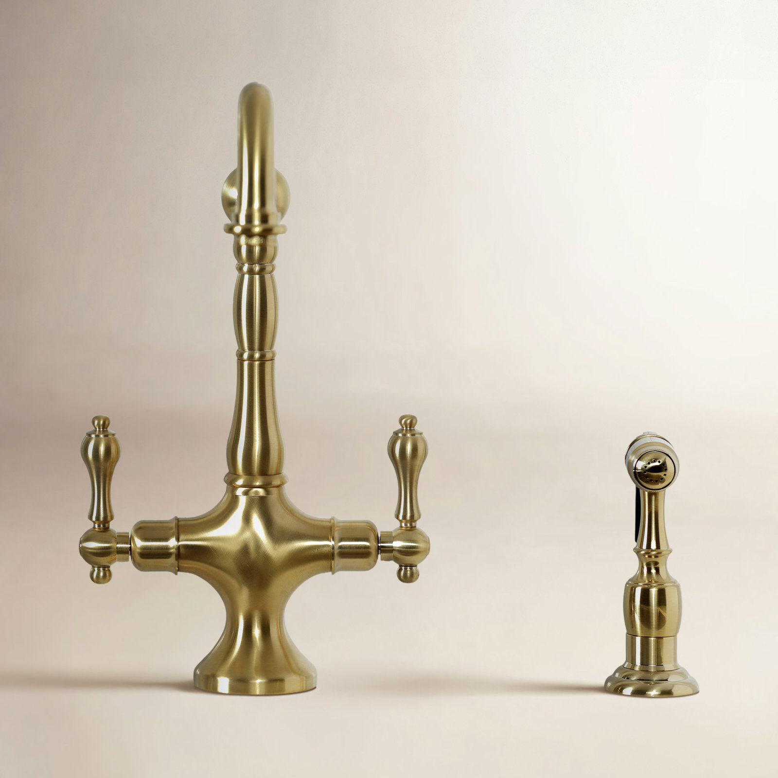 Kingston Brass Heritage Two-Handle Deck Mount Kitchen Faucet, Brushed Brass, With Spray