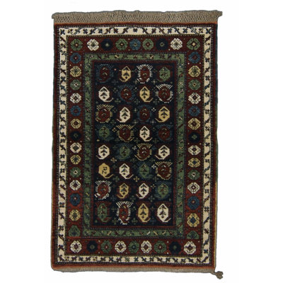 Seychour Wool Oriental Area Rug in Green/Red