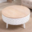 Table basse ronde à plateau relevable avec rangement caché et base sculptée - Bois naturel et blanc