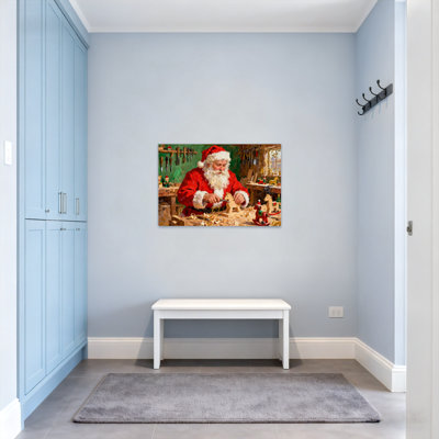 Père Noël de Noël fabriquant des jouets en bois dans un atelier