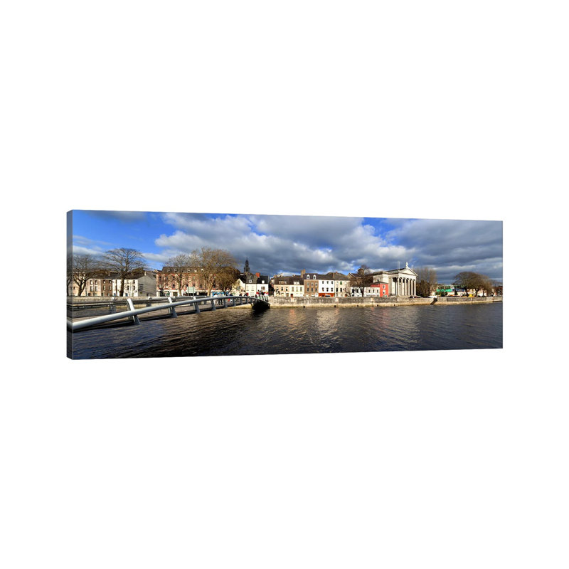The Millenium Foot Bridge Over The River Lee,St Annes Church Behind, And St Mary's Church (Right),Cork City, Ireland by Panoramic Images - Wrapped Canvas Panoramic Print