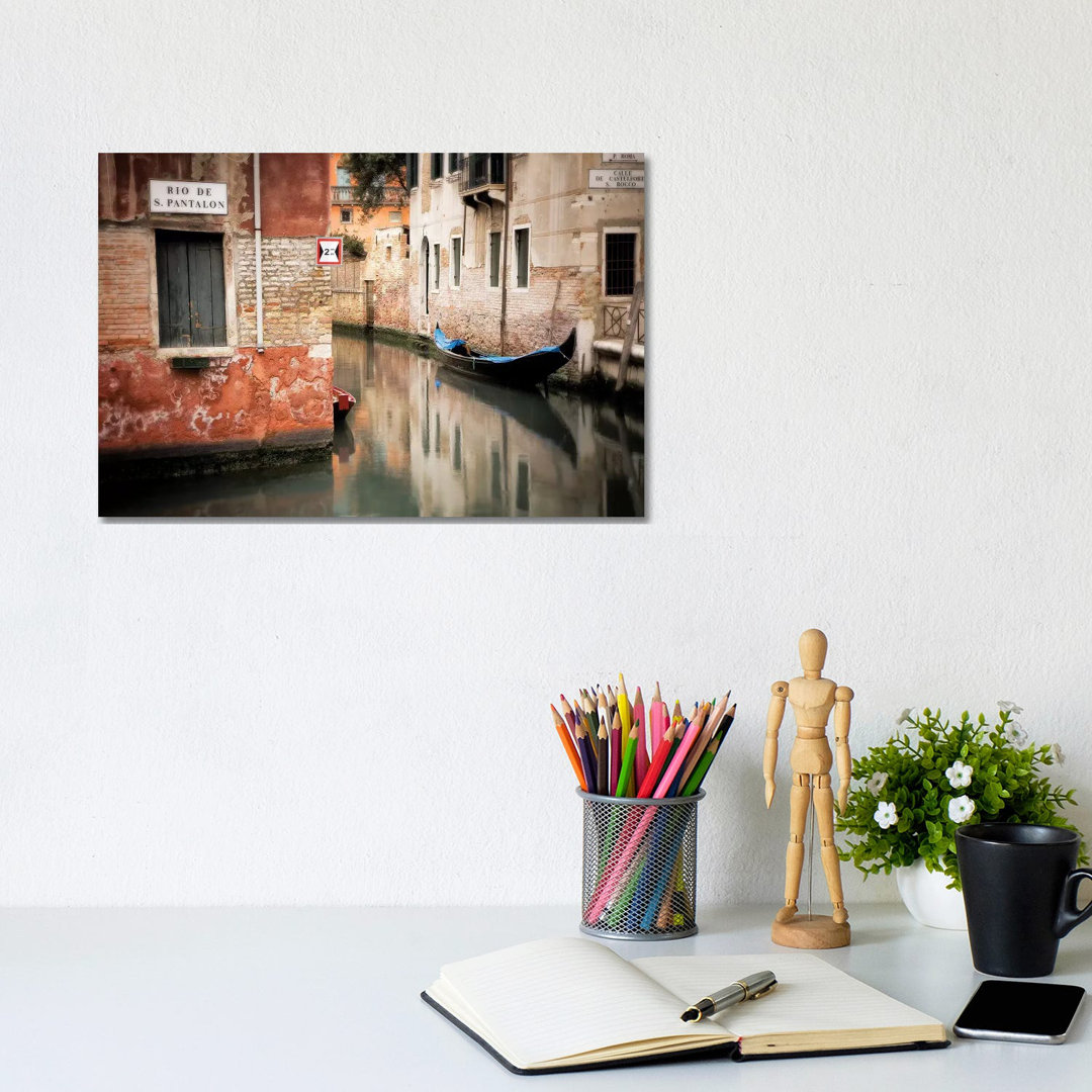 Italy, Venice. Gondola Moored In Canal. by Jaynes Gallery - Wrapped Canvas Print