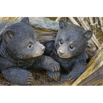 Bear Cubs Hiding Under Log Statue