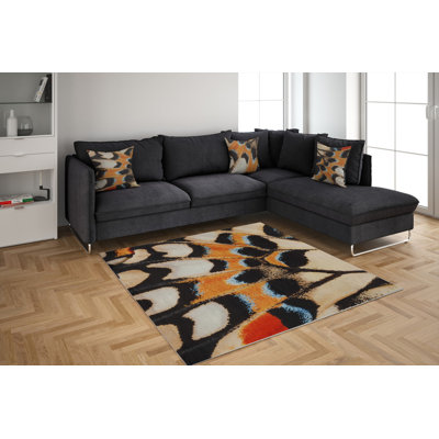 Dwerg Animal Print Machine Tufted Polyester Area Rug in Black/Beige/Orange