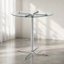 Table de bar ronde en verre avec base chromée pour petits espaces