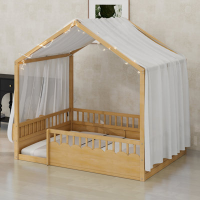 Lit de sol Montessori pour enfants avec ciel de toit en forme de maison, barrières de sécurité et étagère à livres