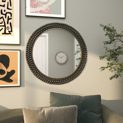 Miroir mural en métal avec détails perlés