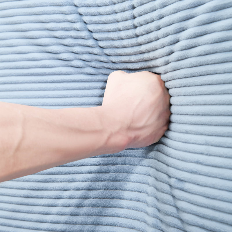 Canapé en velours côtelé bleu avec soutien ergonomique, coussins haute densité et agencement modulaire : coussins profonds surdimensionnés et amovibles