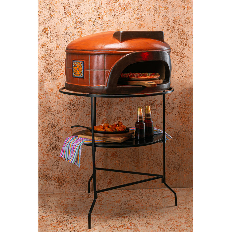 https://assets.wfcdn.com/im/11502612/resize-h755-w755%5Ecompr-r85/2493/249333007/Talavera+Clay+Freestanding+Wood+Burning+Pizza+Oven+in+Orange.jpg