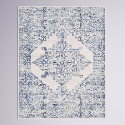 Tapis bleu sarcelle à motif floral Shyann