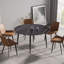 Table de salle à manger moderne en pierre artificielle avec pieds en métal durables, parfaite pour les cuisines et les salles à manger contemporaines.-108962980-108962983
