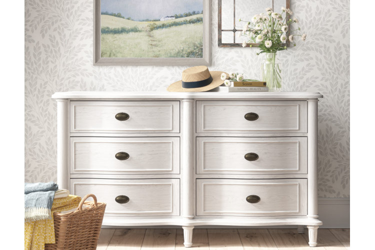 airy farmhouse bedroom with a whitewashed dresser