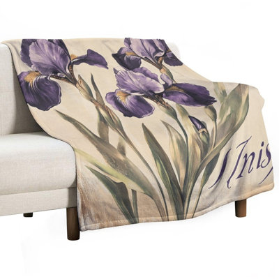Jeté mauve en flanelle de luxe sur fond beige, couverture douce et chaude pour le canapé-lit du salon