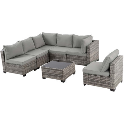 Ensemble de 7 pièces de mobilier d'extérieur modulaire toutes saisons avec coussins épais, table en verre trempé et osier résistant aux rayons UV pour la cour, la piscine et le jardin.