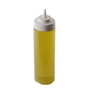 Premium Photo  Squeeze sauce bottle with fresh olive oil inside close up