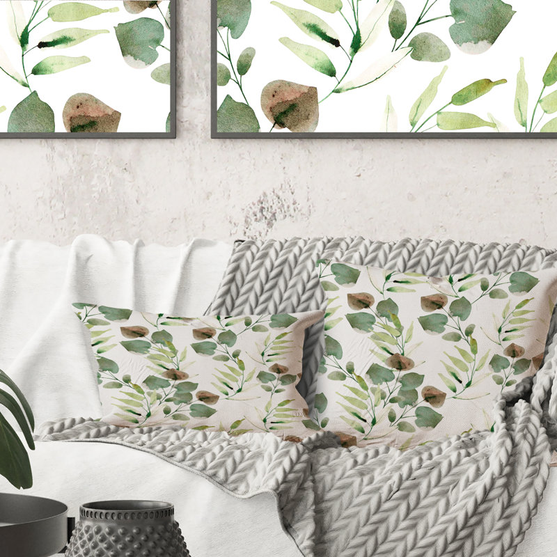 Coussin décoratif tropical à motif de feuilles vertes sur fond blanc