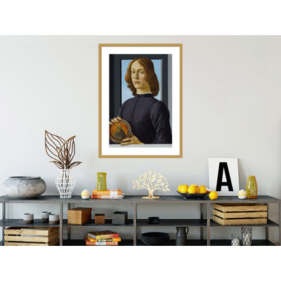 Portrait d'un jeune homme tenant une rondelle par Sandro Botticelli - Impression sur toile encadrée