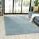Solid Color Machine Woven Polypropylene Area Rug in Blue