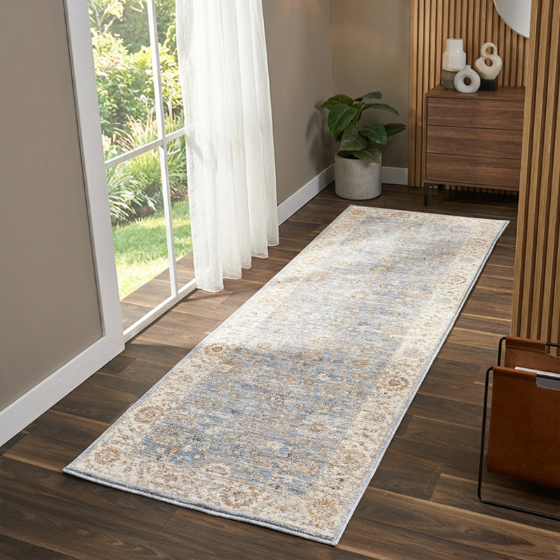 Tapis d'intérieur Vladilen bleu/ivoire à bordure transitionnelle performante, 2 pi 7 po x 7 pi 10 po
