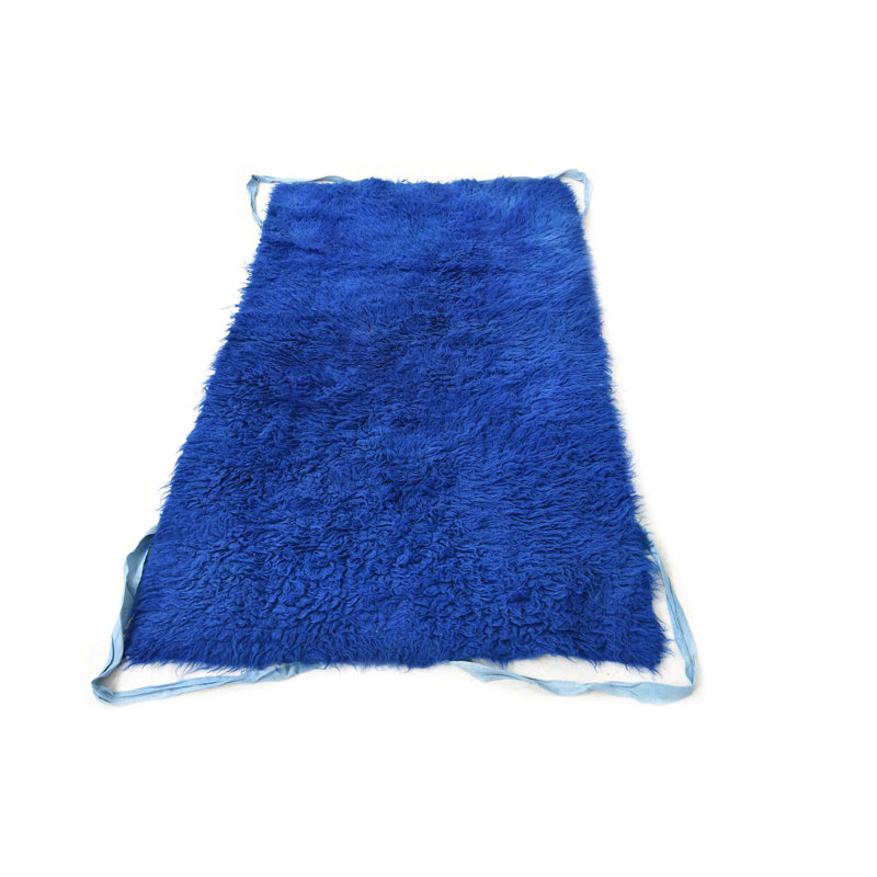 Tapis bleu Kalmanovitz