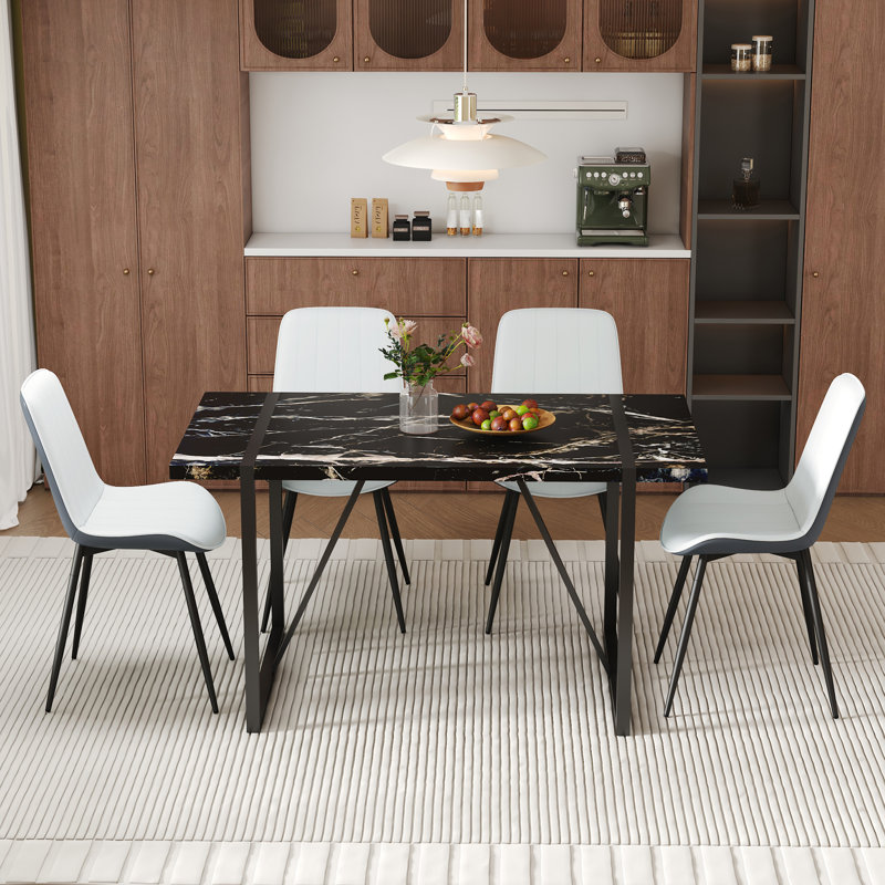 Élégante expérience culinaire avec table en MDF en marbre noir et chaises en cuir PU pour les réunions de famille
