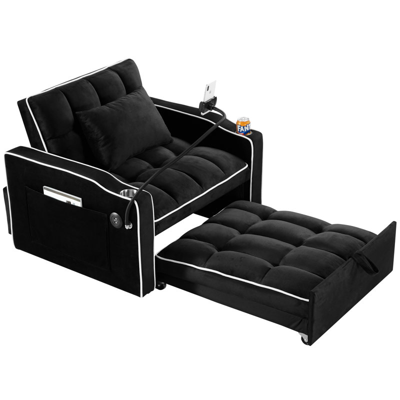 Fauteuil-lit convertible en velours noir, avec porte-gobelets, lit d'appoint réglable et poches de rangement pour le chargement.