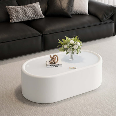Table basse ovale cachée avec rangement en verre trempé et revêtement en cuir pour les salons modernes.