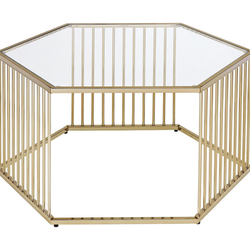 Table basse en champagne et verre transparent