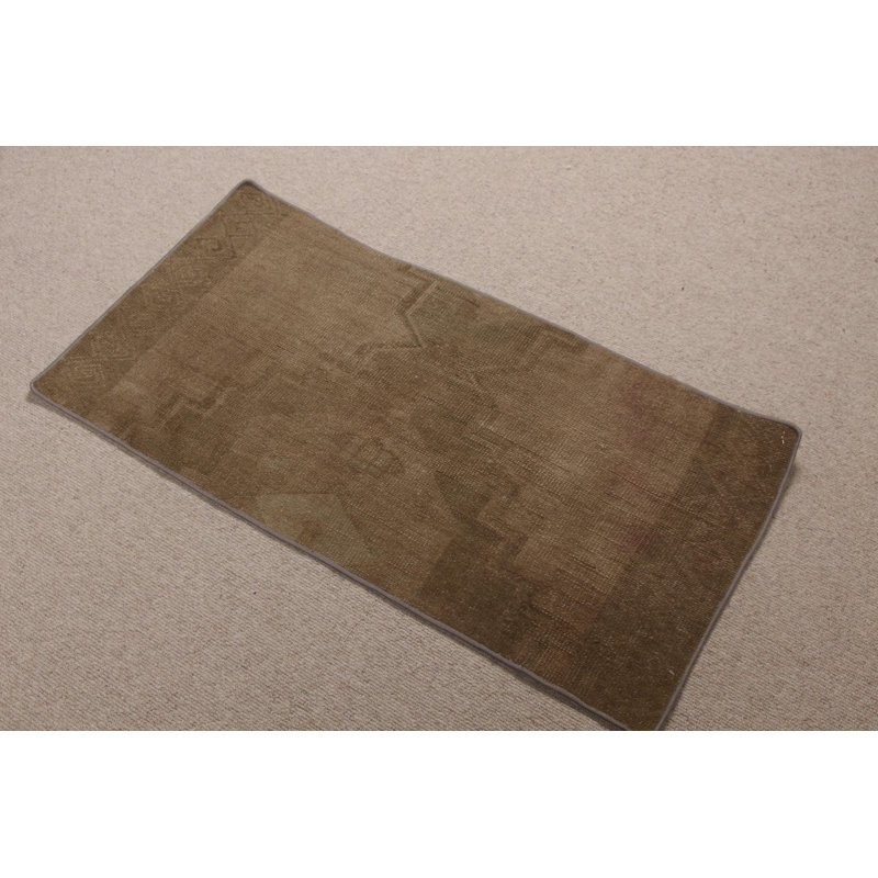 Explore This Vintage Turkish Wool Rug Ideal For Your Entryway Featuring Faded Oushak Design