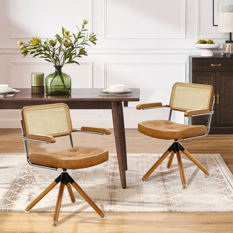 Beorn 19.69'' W Swivel Ratten Back PU Leather Upholstered Dining Arm Chair, Brown Faux Leather