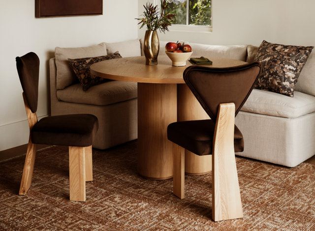 Living room with brown chairs, white couch for SRBs section