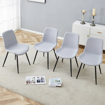 Ensemble confortable de chaises de salle à manger en lin et en coton, quatre pièces. Siège et dossier intégrés, matériau en lin et coton, conception de coussin incurvé élargi pour plus de confort.