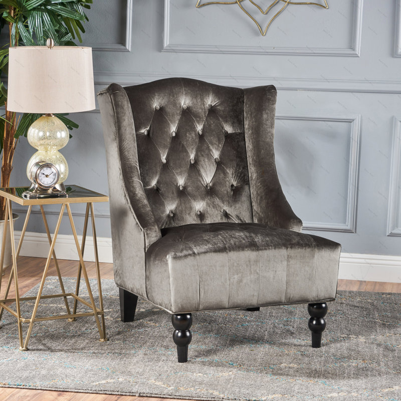 Fauteuil club à dossier haut rembourré et capitonné Danni-Lee pouvant servir de fauteuil d'appoint ou de fauteuil à oreilles dans le salon