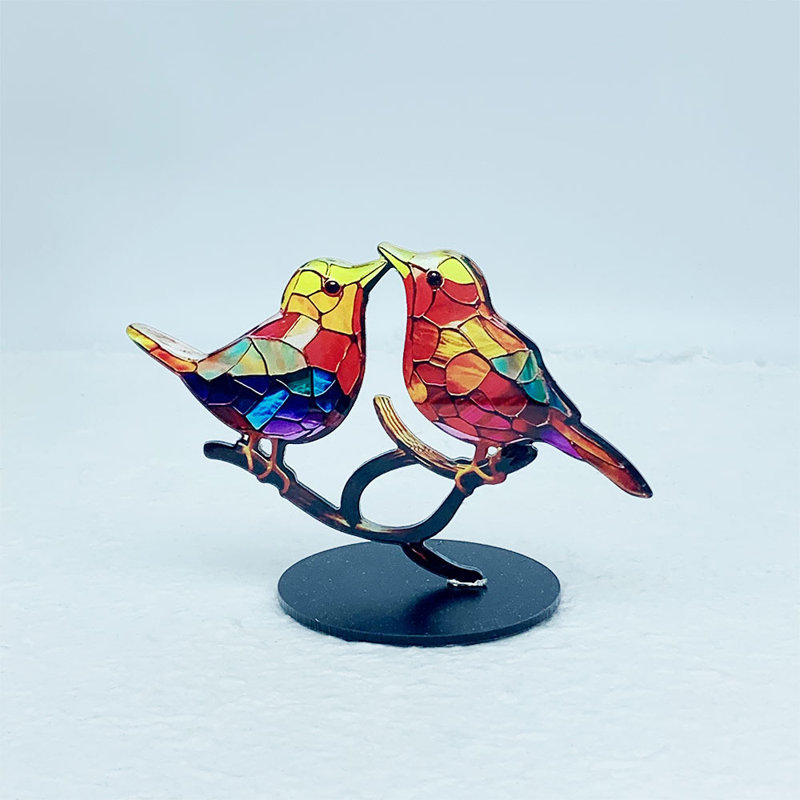 Figurine d'oiseau en acrylique sur une branche