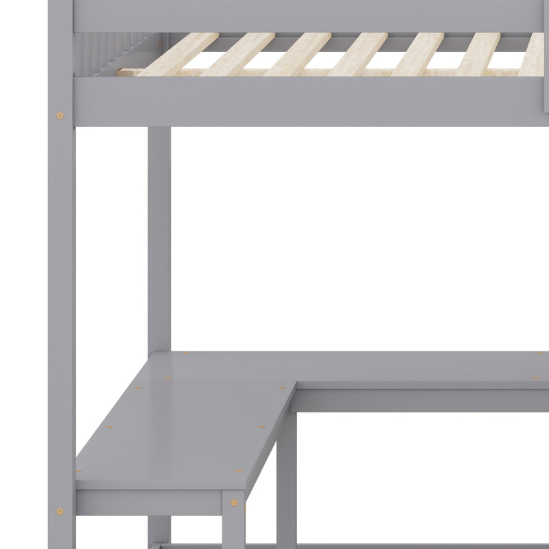 Lit mezzanine avec bureau intégré en forme de L et tablettes de rangement à trois niveaux, et escalier de rangement attaché