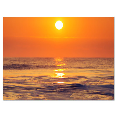 Reproduction de photo sur toile tendue, "orange scintillant et eau de mer"
