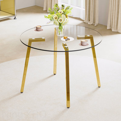 Table de salle à manger moderne moderne minimaliste avec plateau en verre trempé transparent et pieds en métal doré