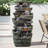 Durwyn 48'' High 6-Tier Cascading Rock Outdoor Water Fountain with LED Lights