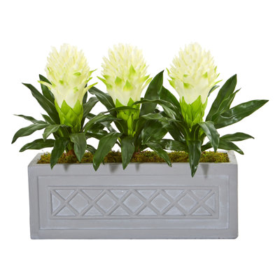 Arrangement floral artificiel bromeliad dans un pot de fleurs